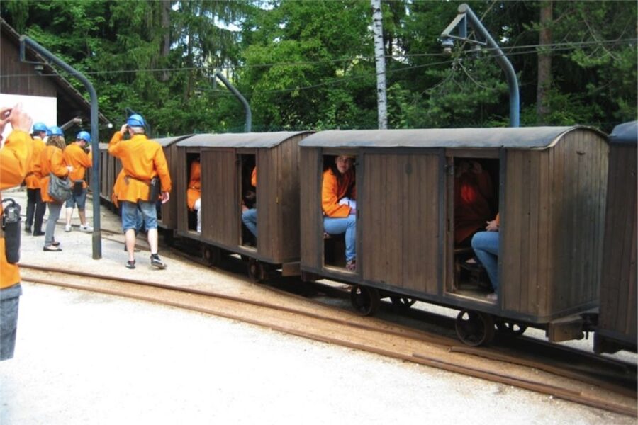 From Bled: Full-Day Underground Kayaking - Entering the mine: train descent, steep stairs, and steady feet