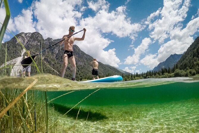 Half Day Stand-up Paddle Boarding (SUP) trip on Lake Predil - Paddling the Lake Predil route, with mountain views and guided context