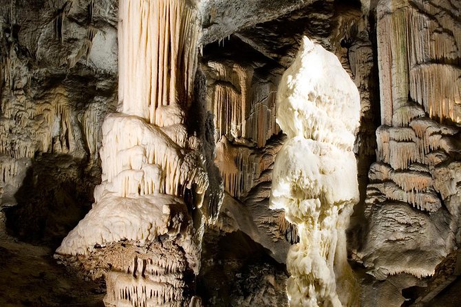 Postojna Cave & Photostop Predjama castle - Group Tour from Koper - Getting to Postojna: AC comfort and a guide who sets the scene