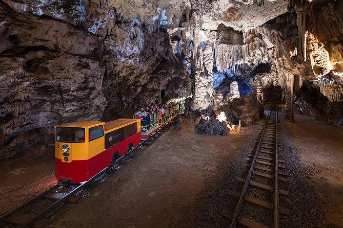 Postojna Cave & Predjama Castle - Small Group Tour from Koper - Postojna Cave: Electric Train, Olm Encounters, and the Stair Reality