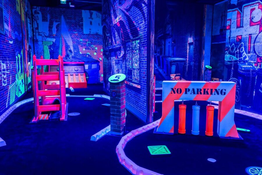 Woop! Glow Golf: Maribor - Playing the Neon 15 Holes, Themes, Props, and Photo Stops